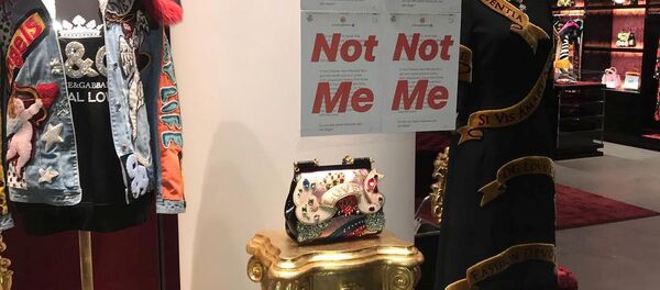 The prints of Stefano Gabbana's Instagram post having written 'Not Me' are seen on a Dolce & Gabbana window store in Shanghai, China November 21, 2018 in this image obtained from social media on November 22, 2018 The prints of Stefano Gabbana's Instagram post having written 'Not Me' are seen on a Dolce & Gabbana window store in Shanghai, China November 21, 2018 in this image obtained from social media on November 22, 2018 - Sputnik International