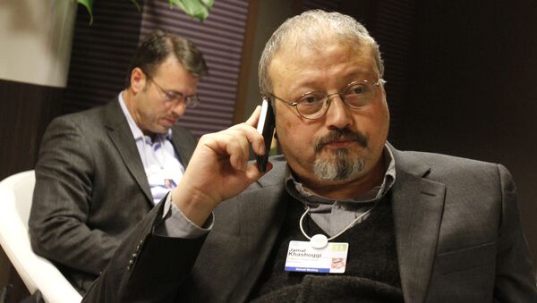 FILE - In this 29 January 2011 file photo, Saudi journalist Jamal Khashoggi speaks on his cellphone at the World Economic Forum in Davos, Switzerland.  - Sputnik International