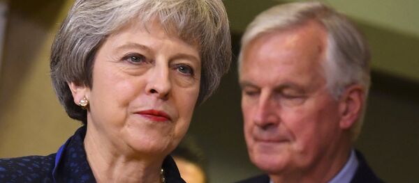 British Prime Minister Theresa May, left, walks ahead of European Union chief Brexit negotiator Michel Barnier prior to a meeting with European Commission President Jean-Claude Juncker at EU headquarters in Brussels, Saturday, Nov. 24, 2018 - Sputnik International