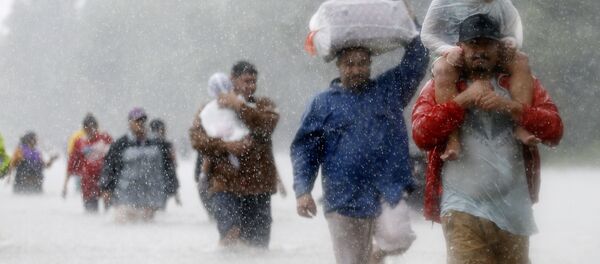Residents wade through flood waters from Tropical Storm Harvey in Beaumont Place, Houston, Texas, U.S., on August 28, 2017 Residents wade through flood waters from Tropical Storm Harvey in Beaumont Place, Houston, Texas, U.S., on August 28, 2017 - Sputnik International