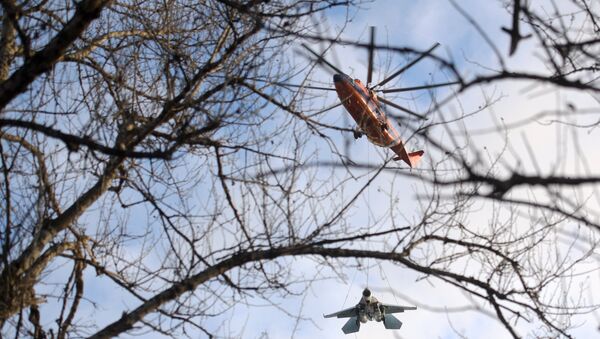 Mi-26 Helicopter Hauling Around 15-Tonne Su-27 Fighter - Sputnik International