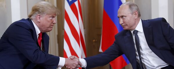 In this file photo taken on Monday, July 16, 2018, U.S. President Donald Trump, left, and Russian President Vladimir Putin, shake hands at the beginning of a meeting at the Presidential Palace in Helsinki, Finland. In this file photo taken on Monday, July 16, 2018, U.S. President Donald Trump, left, and Russian President Vladimir Putin, shake hands at the beginning of a meeting at the Presidential Palace in Helsinki, Finland. - Sputnik International