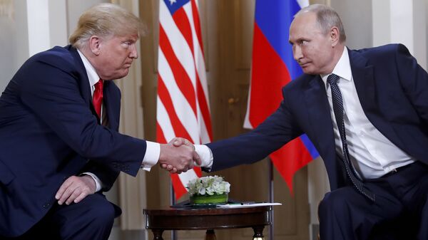 In this file photo taken on Monday, July 16, 2018, U.S. President Donald Trump, left, and Russian President Vladimir Putin, shake hands at the beginning of a meeting at the Presidential Palace in Helsinki, Finland. - Sputnik International