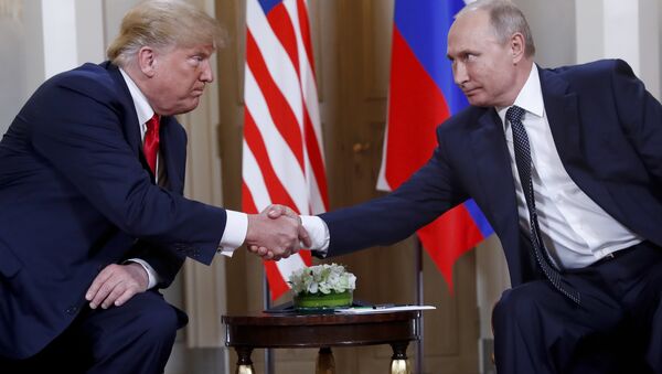 In this file photo taken on Monday, July 16, 2018, U.S. President Donald Trump, left, and Russian President Vladimir Putin, shake hands at the beginning of a meeting at the Presidential Palace in Helsinki, Finland. - Sputnik International