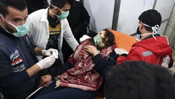A Syrian woman receives treatment at a hospital in the regime controlled Aleppo on November 24, 2018 - Sputnik International