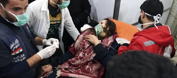 A Syrian woman receives treatment at a hospital in the regime controlled Aleppo on November 24, 2018 - Sputnik International