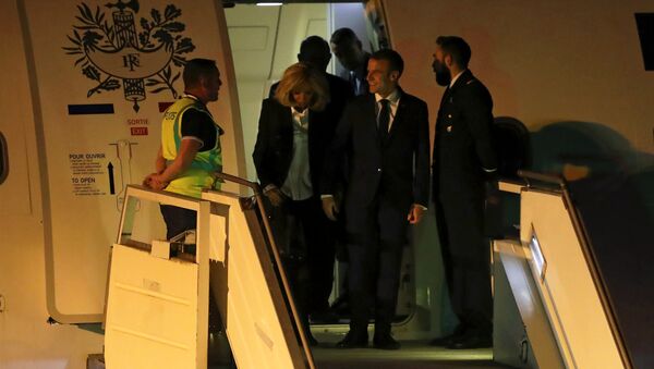 French President Emmanuel Macron and his wife Brigitte Macron arrive at Ministro Pistarini International Airport for the G20 leaders summit in Buenos Aires, Argentina November 28, 2018 - Sputnik International