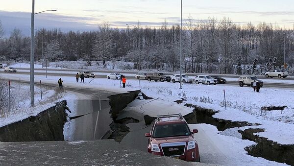 A car is trapped on a collapsed section of the offramp of Minnesota Drive in Anchorage, Friday, Nov. 30, 2018. - Sputnik International