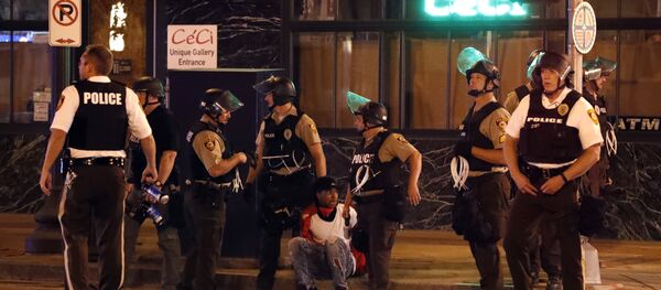 Police detain a man after a earlier peaceful protest in response to a not guilty verdict in the trial of former St. Louis police officer Jason Stockley turned violent Sunday, Sept. 17, 2017, in St. Louis. - Sputnik International