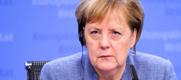 Germany's Chancellor Angela Merkel attends a press conference after a special meeting of the European Council to endorse the draft Brexit withdrawal agreement and to approve the draft political declaration on future EU-UK relations on November 25, 2018 in Brussels. - Sputnik International