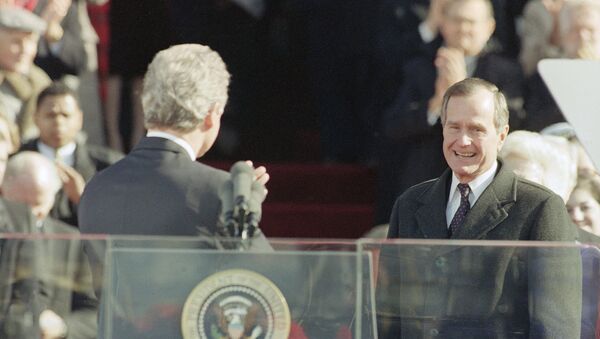 Pres. Bill Clinton, left, gestures toward former Pres. George H. W. Bush after giving his inaugural speech on Capitol Hill, Wednesday, Jan. 21, 1993, Washington, Washington, D.C - Sputnik International