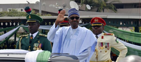 Nigerian President, Muhammadu Buhari, waves to the crowd during the 58th anniversary celebrations of Nigerian independence, in Abuja, Nigeria, Monday, Oct. 1, 2018 Nigerian President, Muhammadu Buhari, waves to the crowd during the 58th anniversary celebrations of Nigerian independence, in Abuja, Nigeria, Monday, Oct. 1, 2018 - Sputnik International