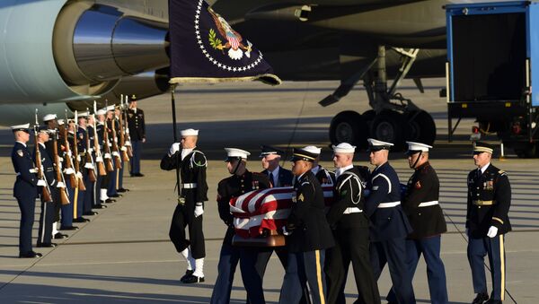 Casket of former President George H.W. Bush is carried by a joint services military honor guard to a hearse at Andrews Air Force Base in Maryland - Sputnik International