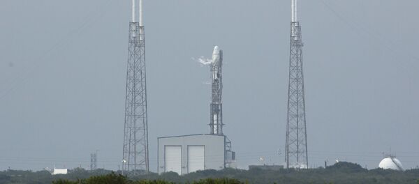 An unmanned SpaceX Falcon 9 rocket with a Dragon capsule sits on launch pad 40 after a scrubbed launch attempt An unmanned SpaceX Falcon 9 rocket with a Dragon capsule sits on launch pad 40 after a scrubbed launch attempt - Sputnik International