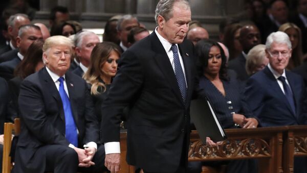 Former President George W. Bush walks past President Donald Trump, first lady Melania Trump, Michelle Obama and former President Bill Clinton to give a eulogy for his father - Sputnik International
