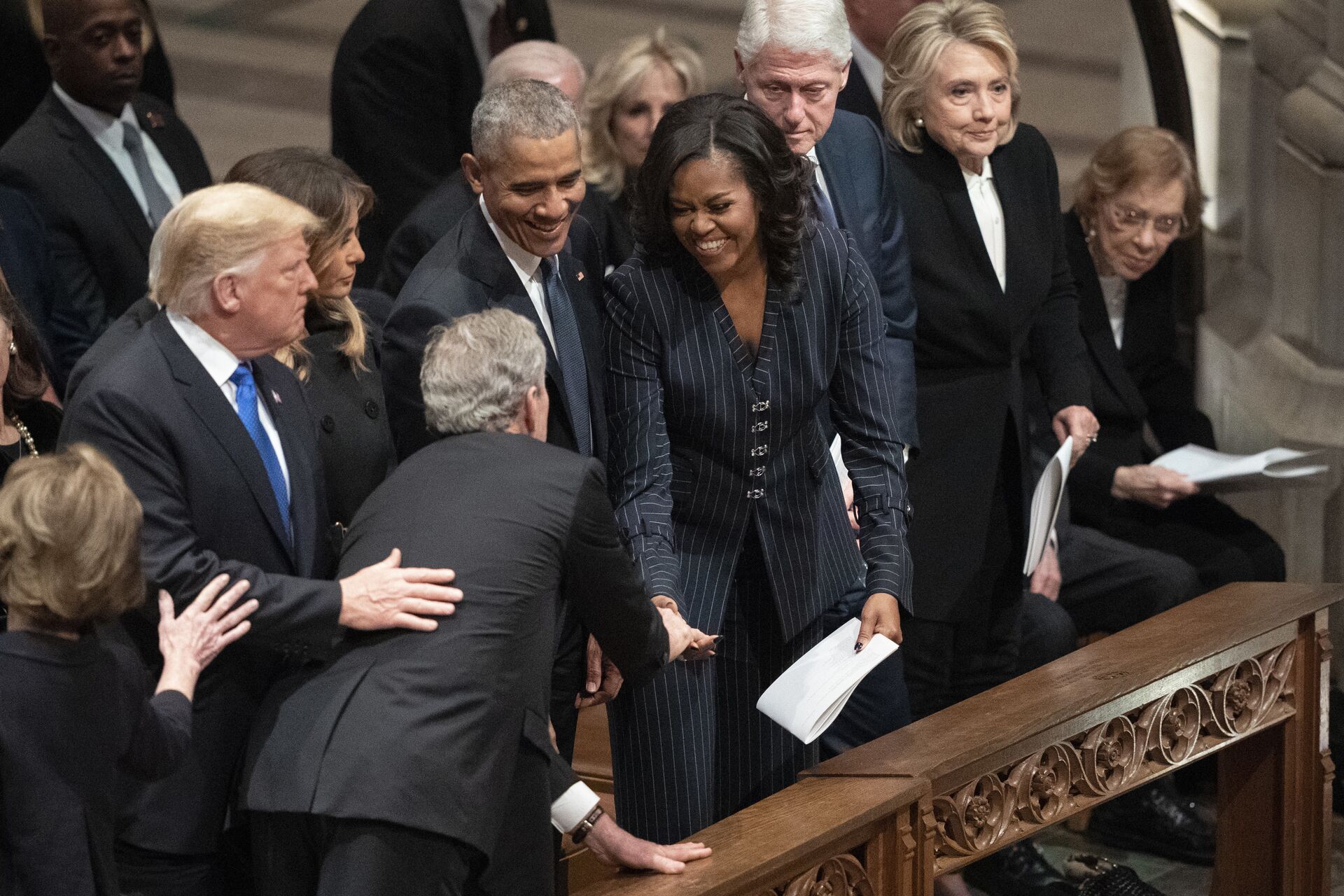 President George W. Bush and wife Laura Bush greets President Donald Trump, first lady Melania Trump, former President Barack Obama, Michelle Obama, former President Bill Clinton, former Secretary of State Hillary Clinton, former President Jimmy Carter, and Rosalynn Carter during a State Funeral for former President George H.W. Bush at the National Cathedral, Wednesday, Dec. 5, 2018, in Washington. - Sputnik International, 1920, 20.12.2021