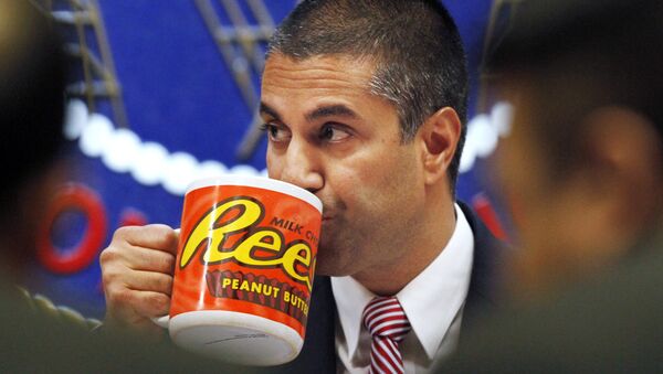 Federal Communications Commission (FCC) Chairman Ajit Pai takes a drink from a mug during an FCC meeting where the FCC voted on net neutrality, in Washington.  - Sputnik International