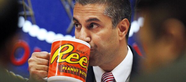 Federal Communications Commission (FCC) Chairman Ajit Pai takes a drink from a mug during an FCC meeting where the FCC voted on net neutrality, in Washington.  - Sputnik International