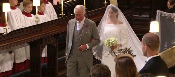 In this frame from video, Meghan Markle walks down the aisle with Prince Charles for her wedding ceremony at St. George's Chapel in Windsor Castle in Windsor, near London, England, Saturday, May 19, 2018. In this frame from video, Meghan Markle walks down the aisle with Prince Charles for her wedding ceremony at St. George's Chapel in Windsor Castle in Windsor, near London, England, Saturday, May 19, 2018. - Sputnik International
