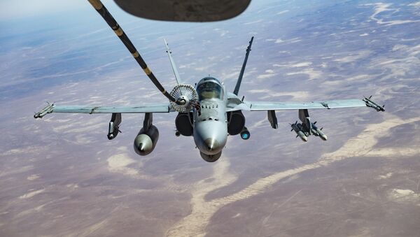 An F/A-18C receives fuel from a KC-10 Extender, one of the refueling aircraft belonging to US Central Command. - Sputnik International