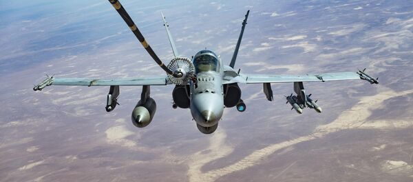 An F/A-18C receives fuel from a KC-10 Extender, one of the refueling aircraft belonging to US Central Command. An F/A-18C receives fuel from a KC-10 Extender, one of the refueling aircraft belonging to US Central Command. - Sputnik International