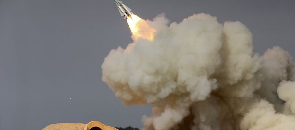 In this Dec. 29, 2016 file photo, released by the semi-official Iranian Students News Agency (ISNA), a long-range S-200 missile is fired in a military drill in the port city of Bushehr, on the northern coast of Persian Gulf, Iran - Sputnik International