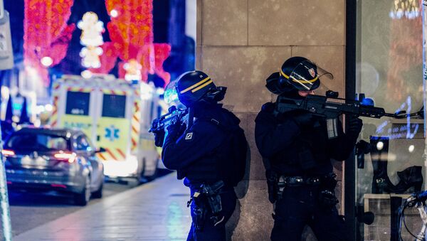 French police officers stand guard near the scene of a shooting on December 11, 2018 in Strasbourg, eastern France. - Sputnik International