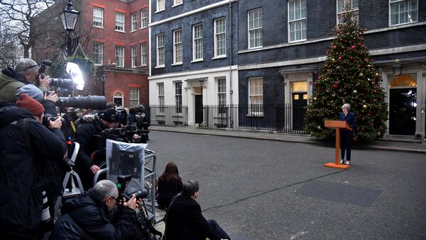 Britain's Prime Minister Theresa May addresses the media outside 10 Downing Street after it was announced that the Conservative Party will hold a vote of no confidence in her leadership, in London, Britain, December 12, 2018 - Sputnik International
