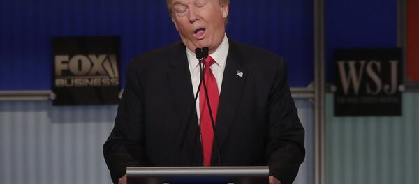 Republican presidential candidate Donald Trump reacts to Carly Fiorina during the Republican Presidential Debate hosted by Fox Business and The Wall Street Journal November 10, 2015 in Milwaukee, Wisconsin - Sputnik International