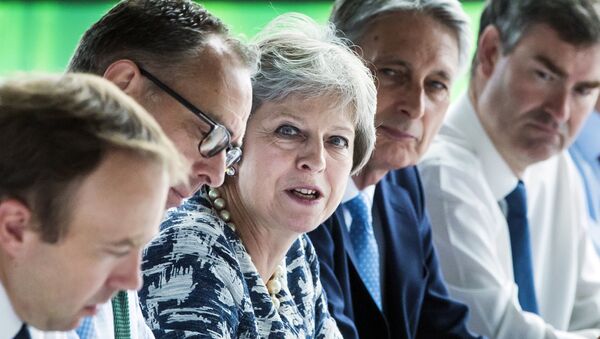 Britain's Prime Minister Theresa May (C) chairs a meeting of her Cabinet at Sage Gateshead, in Gateshead, north-east England on July 23, 2018. - Sputnik International
