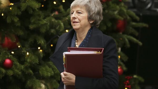 Britain's Prime Minister Theresa May leaves 10 Downing Street to attend the weekly Prime Ministers' Questions session, at parliament in London, Wednesday, Dec. 12, 2018. May has confirmed there will be a vote of confidence in her leadership of the Conservative Party, in Parliament Wednesday evening, with the result expected to be announced soon after. - Sputnik International