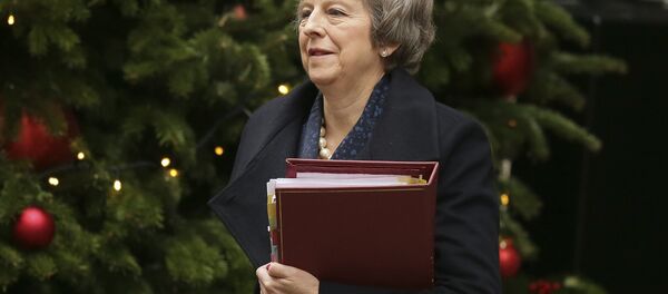 Britain's Prime Minister Theresa May leaves 10 Downing Street to attend the weekly Prime Ministers' Questions session, at parliament in London, Wednesday, Dec. 12, 2018. May has confirmed there will be a vote of confidence in her leadership of the Conservative Party, in Parliament Wednesday evening, with the result expected to be announced soon after. - Sputnik International