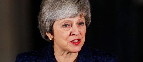 Britain's Prime Minister Theresa May speaks outside 10 Downing Street after a confidence vote by Conservative Party Members of Parliament (MPs), in London, Britain December 12, 2018. Britain's Prime Minister Theresa May speaks outside 10 Downing Street after a confidence vote by Conservative Party Members of Parliament (MPs), in London, Britain December 12, 2018. - Sputnik International