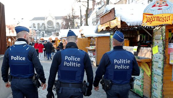 Belgian police officers patrol the area of Christmas market in central Brussels, Belgium, December 12, 2018 - Sputnik International