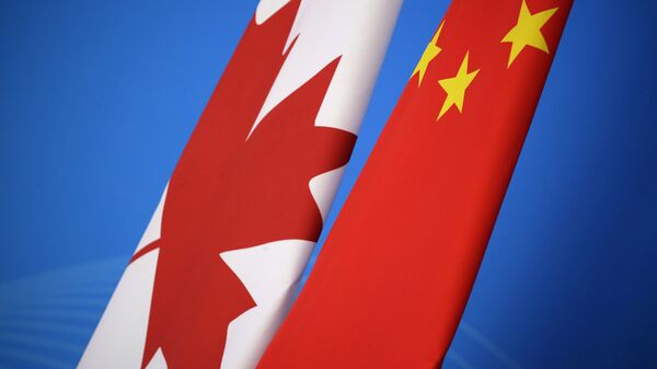 Flags of Canada and China are placed for the first China-Canada economic and financial strategy dialogue in Beijing, China, Monday, Nov. 12, 2018 - Sputnik International