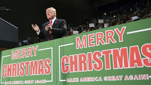 In this Dec. 8, 2017, file photo, President Donald Trump takes to the stage at a campaign-style rally at the Pensacola Bay Center, in Pensacola, Fla. (File photo) - Sputnik International
