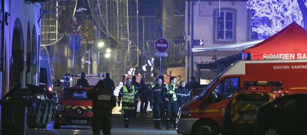 Policemen and emergency medical response vehicules are seen in the rue des Grandes Arcades in Strasbourg, eastern France, after a shooting breakout, on December 11, 2018. Policemen and emergency medical response vehicules are seen in the rue des Grandes Arcades in Strasbourg, eastern France, after a shooting breakout, on December 11, 2018. - Sputnik International