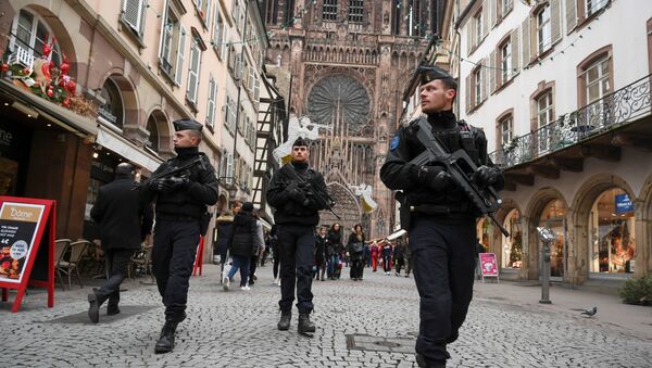 French policemen patrol during the reopening of the christmas market of Strasbourg, eastern France, on December 14, 2018 as the author of the attack was killed on December 13, 2018. - Sputnik International