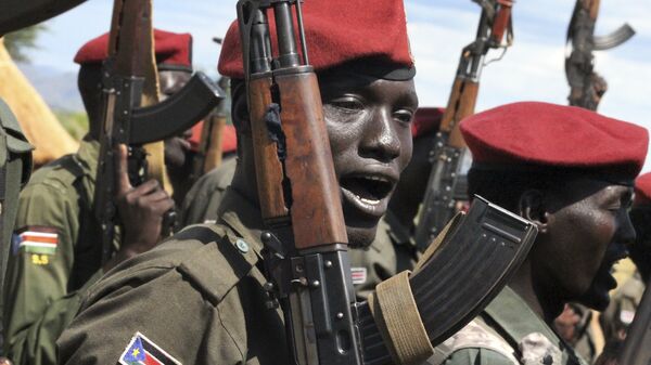 In this photo taken Thursday, April 14, 2016, government soldiers follow orders to raise their guns during a military parade in Juba, South Sudan - Sputnik International