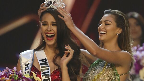 Catriona Gray of the Philippines, left, reacts as she is crowned the new Miss Universe 2018 by Miss Universe 2017 Demi-Leigh Nel-Peters during the final round of the 67th Miss Universe competition in Bangkok, Thailand, Monday, Dec. 17, 2018. - Sputnik International