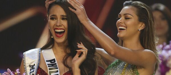 Catriona Gray of the Philippines, left, reacts as she is crowned the new Miss Universe 2018 by Miss Universe 2017 Demi-Leigh Nel-Peters during the final round of the 67th Miss Universe competition in Bangkok, Thailand, Monday, Dec. 17, 2018. Catriona Gray of the Philippines, left, reacts as she is crowned the new Miss Universe 2018 by Miss Universe 2017 Demi-Leigh Nel-Peters during the final round of the 67th Miss Universe competition in Bangkok, Thailand, Monday, Dec. 17, 2018. - Sputnik International