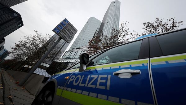 Police vehicles are parked in front of Deutsche Bank headquarters as roughly 170 criminal police officers, prosecutors and tax inspectors searched Deutsche Bank offices in and around Frankfurt, Germany, November 29, 2018 - Sputnik International