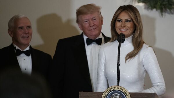 First lady Melania Trump, opined by President Donald Trump, and Vice President Mike Pence pauses as she speaks during the Congressional Ball in the Grand Foyer of the White House in Washington, Saturday, Dec. 15, 2018 - Sputnik International