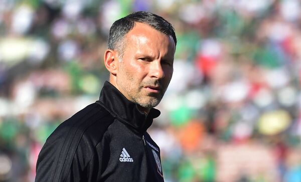 Wales coach and former Manchester United star Ryan Giggs walks off the pitch prior to kickoff against Mexico in an international football friendly at the Rose Bowl in Pasadena, California on May 28, 2018 where the game ended 0-0 - Sputnik International