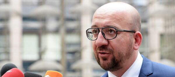 Belgian Prime Minister Charles Michel answers journalists' questions as he arrives for a meeting in Brussels of the leaders of the 19 countries that use the euro, on July 12, 2015. Belgian Prime Minister Charles Michel answers journalists' questions as he arrives for a meeting in Brussels of the leaders of the 19 countries that use the euro, on July 12, 2015. - Sputnik International