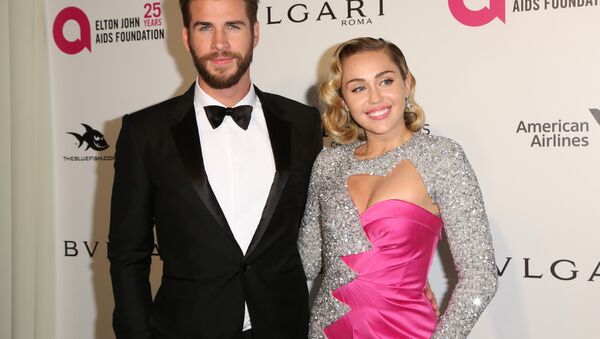 Liam Hemsworth, left, and Miley Cyrus arrive at the 2018 Elton John AIDS Foundation Oscar Viewing Party on Sunday, March 4, 2018, in West Hollywood, Calif. - Sputnik International