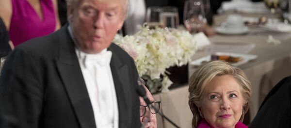 Republican presidential candidate Donald Trump, left, accompanied by Democratic presidential candidate Hillary Clinton, right, speaks at the 71st annual Alfred E. Smith Memorial Foundation Dinner, a charity gala organized by the Archdiocese of New York, Thursday, Oct. 20, 2016, at the Waldorf Astoria hotel in New York Republican presidential candidate Donald Trump, left, accompanied by Democratic presidential candidate Hillary Clinton, right, speaks at the 71st annual Alfred E. Smith Memorial Foundation Dinner, a charity gala organized by the Archdiocese of New York, Thursday, Oct. 20, 2016, at the Waldorf Astoria hotel in New York - Sputnik International
