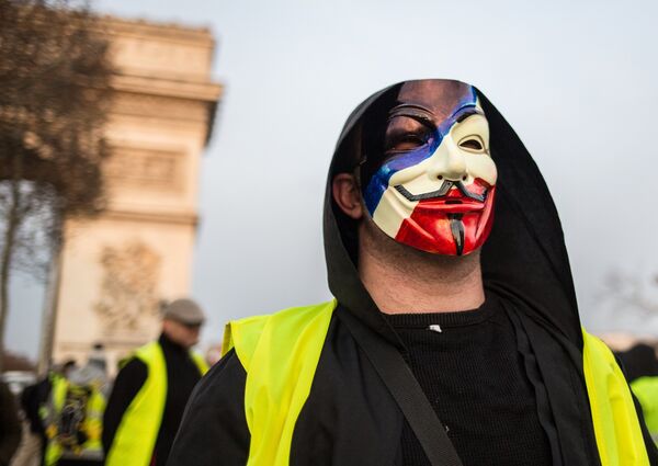 A protester takes part in a demonstration of the yellow vests movement in Paris, France. A protester takes part in a demonstration of the yellow vests movement in Paris, France. - Sputnik International