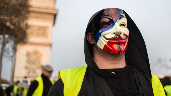 A protester takes part in a demonstration of the yellow vests movement in Paris, France. - Sputnik International
