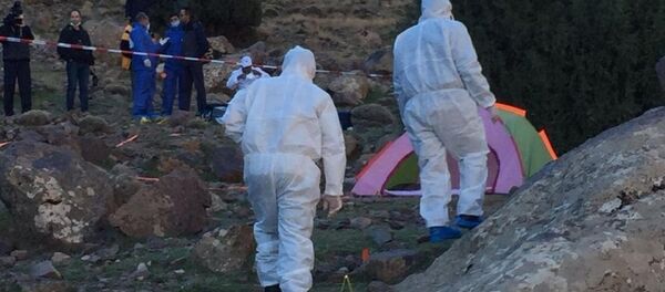 In this photo provided by Moroccan news channel 2M and taken on Tuesday, Dec. 18, 2018, a forensic team is seen at the area where the bodies of two Scandinavian women tourists were found dead, near Imlil in the High Atlas mountains, Morocco In this photo provided by Moroccan news channel 2M and taken on Tuesday, Dec. 18, 2018, a forensic team is seen at the area where the bodies of two Scandinavian women tourists were found dead, near Imlil in the High Atlas mountains, Morocco - Sputnik International